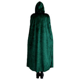 Back view of green velvet hooded cape on female model