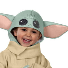 Child wearing official Star Wars Grogu costume with fleece robe and character headpiece