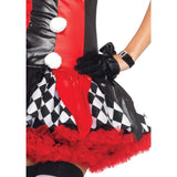 Close-up of harlequin clown skirt with layered fabric and decorative pom-poms
