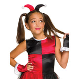 A young girl modeling a red and black jester costume with a matching jester hat and gloves, set against a plain white background.