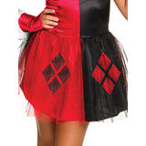 A close-up of a two-tone costume skirt with a red and black split design, featuring a black diamond motif on the red side and a red diamond motif on the black side, worn by a model.