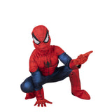 A child wearing a full Spider-Man costume crouching in a dynamic pose against a plain white background.