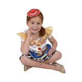 Child wearing Jessie Toy Story costume sitting down with matching cowgirl hat