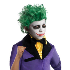 Child wearing an officially licensed Joker Deluxe costume with purple tailcoat and pinstriped trousers
