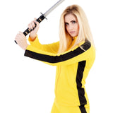 Close-up of ladies kung fu fighter costume showing yellow jumpsuit and black stripe details
