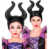 Two people wearing black horn headbands and purple costumes on a white background