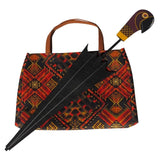 Mary Poppins Returns Accessory Set – includes a printed felt 'carpet' bag with handles and a folding felt umbrella featuring an adjustable metal shaft and parrot design on the handle.