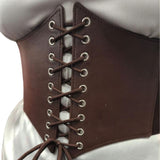 Close-up of a brown leather look corset style belt with laces on a white background