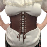Brown corset style belt worn over a white blouse with lace details on a plain background