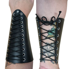 black lace up wrist bracers. side by side of bracers worn. Left shows top view with eyelet decorative lace up and silver rivet detail. right shows inside of wrist with more eyelets and practical lace up for adjustable fit. 