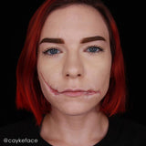 Person demonstrating the use of Mehron Rigid Collodion