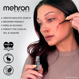 Person applying mehron makeup to create realistic scar FX on a white background