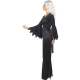 Person wearing a black dress with wide sleeves and a white wig on a white background