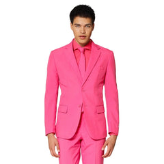Man wearing a bright pink suit with matching tie on a white background