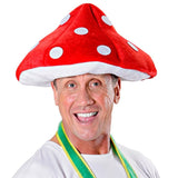 Red and white novelty mushroom hat, polyester cartoon-style costume accessory for adults.