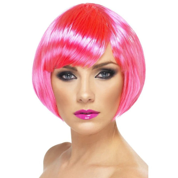 Neon Pink Babe Wig in bob style with fringe, made of smooth synthetic fibre – ideal for parties, cosplay, and playful costumes.