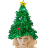Green tinsel Christmas tree hat with decorations on a mannequin head against a white background