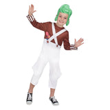 Child wearing a costume with suspenders and a green wig on a white background