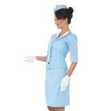 Woman wearing a light blue uniform with a matching hat on a white background