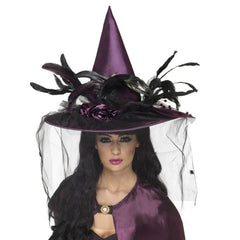 Purple Witch Hat Feathers & Netting, elorbately decorated with ribbon roses, lots of cock feathers and netteing with small spiders.