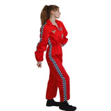 A woman modeling a red jumpsuit with black and white checkered side panels, shown in profile against a plain white background.