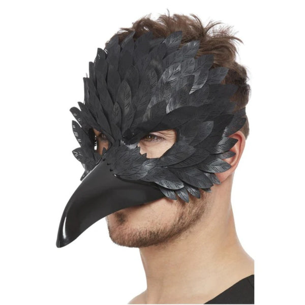 raven mask with long plastic beak and feather look covers the top part of the face.
