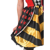 Red Queen of Hearts Costume – close-up of bold black and yellow striped skirt with printed satin peplum featuring Alice in Wonderland character illustrations and decorative trim.