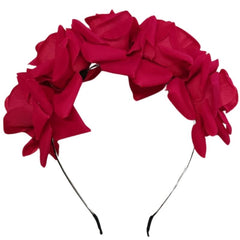 Rose Headband worn on manequin with black plaited wig. Features five red roses