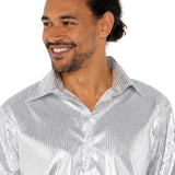 Close-up of silver disco shirt showing metallic sequin print fabric and oversized collar