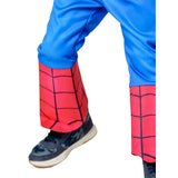 A close-up of a person's legs wearing a Spider-Man themed costume, featuring bright blue pants and red leg warmers with black web lines, paired with dark sneakers.