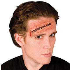 Stitches - 3D Prosthetic by Woochie, spirit gum sold separately.
