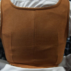 Brown corset vest over a white shirt