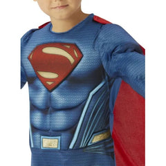Child wearing an officially licensed Superman Deluxe costume with muscle chest and cape