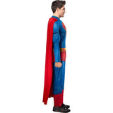Person wearing a Superman costume with a red cape on a white background