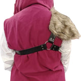 person wearing viking or medieval style harness with silver metal ring and details and a fur accent on the shoulder shown from the back