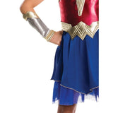 wonder woman child costume, dress with gold belt, blue layered skirt and gauntlets.