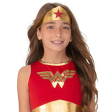 wonder woman costume child with gold headband, dress with red bodice and blue star print skirt.