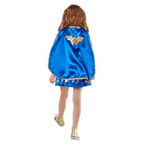 A child shown from the back wearing a shiny blue cape with gold trim and a large gold Wonder Woman logo on the back, photographed against a plain white background.