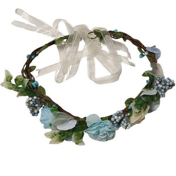 Floral headband with greenery and ribbons on a white background