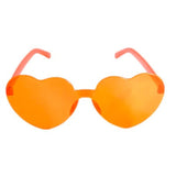  Heart-shaped orange Perspex party glasses.  Description: These vibrant party glasses are crafted from orange Perspex material, forming a whimsical heart shape. The transparent orange color adds a playful touch, making them the perfect accessory for festive occasions