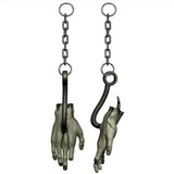 Bloody zombie hand on chain and meat hook.