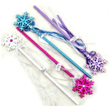 snowflake glitter fairy wands in white, pink, blue and purple with ribbons and diamante.