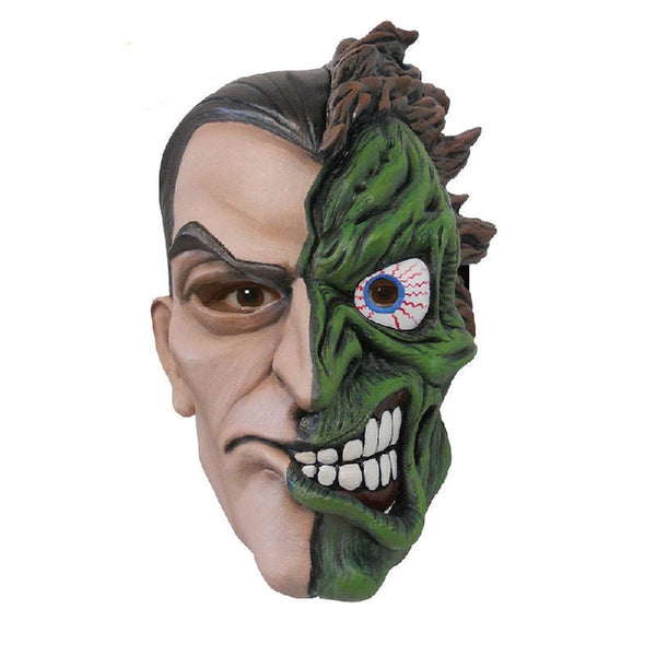 Two face latex mask, normal one side and green scarred the other.