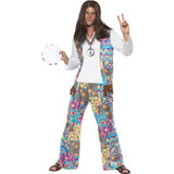 Groovy hippie men’s costume with white shirt, floral patchwork waistcoat with tassels, and matching flared trousers
