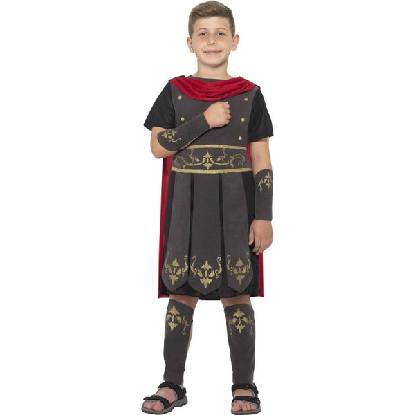 roman soldier costume for boys with black tunic and attached gladiator skirt with gold embellishments, matching arm guards and shin guards.